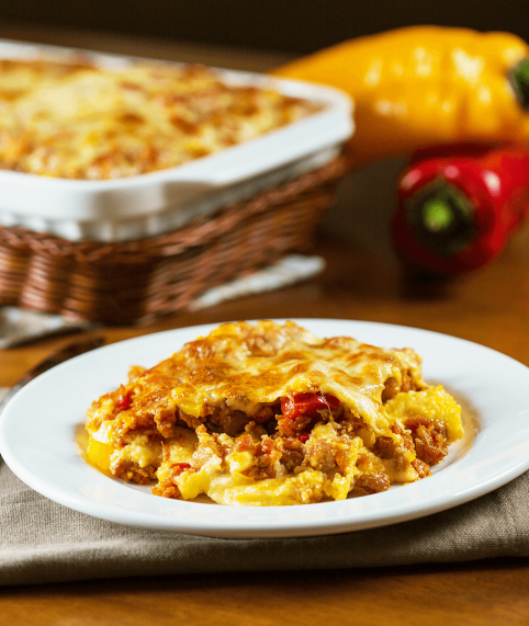 Se necessário, untar o recipiente refratário com manteiga antes de montar a polenta.